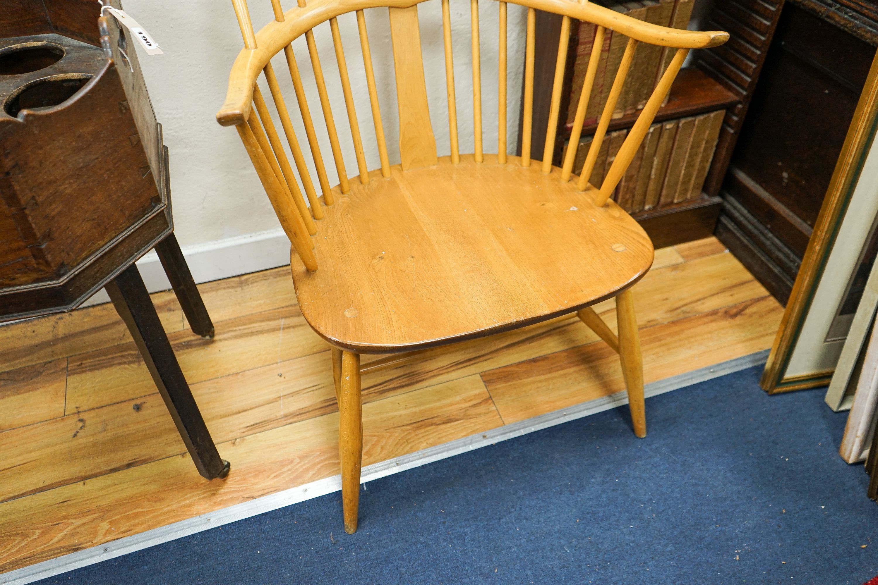 An Ercol light elm and beech comb back Windsor armchair